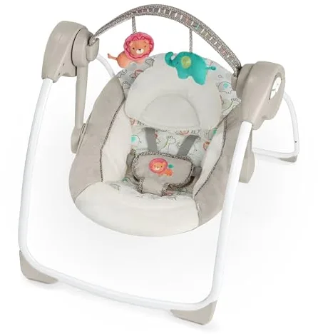 Ingenuity, Columpio Compacto y Plegable Cozy Kingdom - 6 Velocidades de Balanceo, 12 Melodías Calmantes, Arco de Juego Desmontable, 2 Juguetes de Peluche, Arnés de 5 Puntos, Desde Recién Nacido